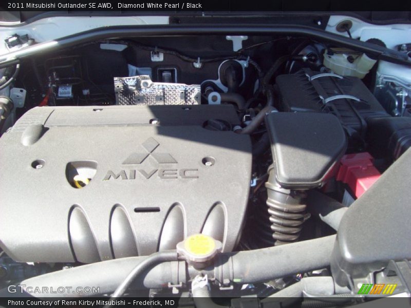Diamond White Pearl / Black 2011 Mitsubishi Outlander SE AWD