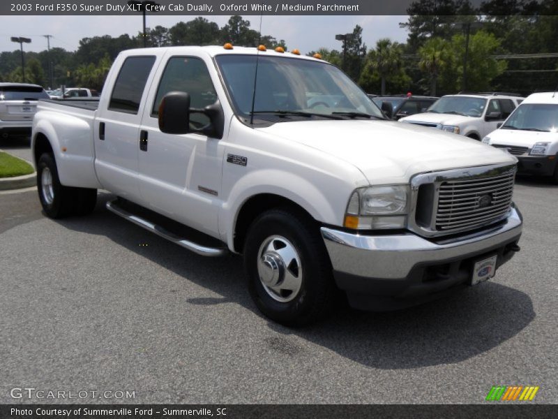 Front 3/4 View of 2003 F350 Super Duty XLT Crew Cab Dually