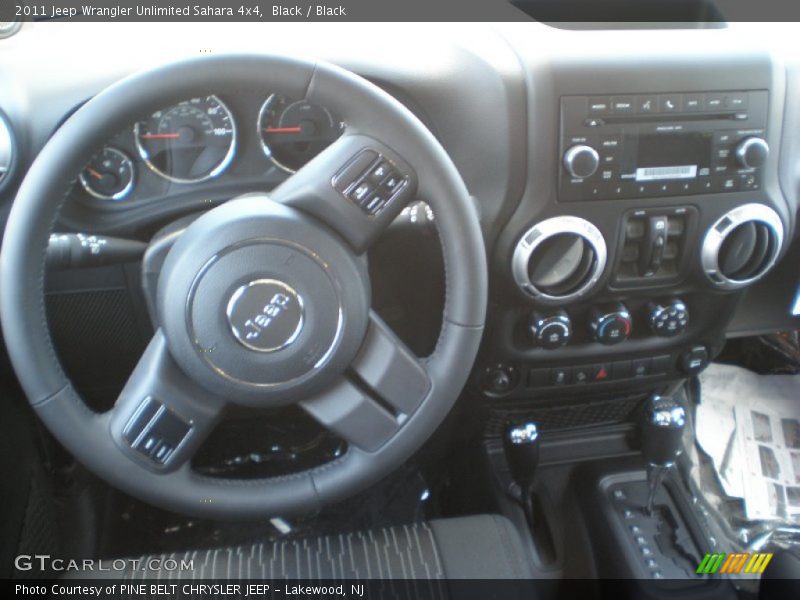 Black / Black 2011 Jeep Wrangler Unlimited Sahara 4x4