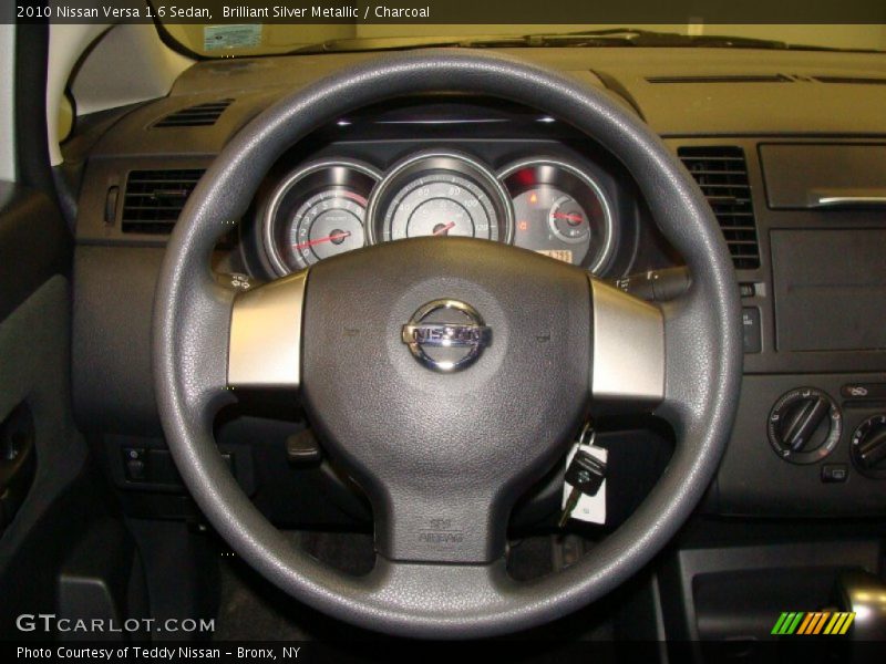 Brilliant Silver Metallic / Charcoal 2010 Nissan Versa 1.6 Sedan