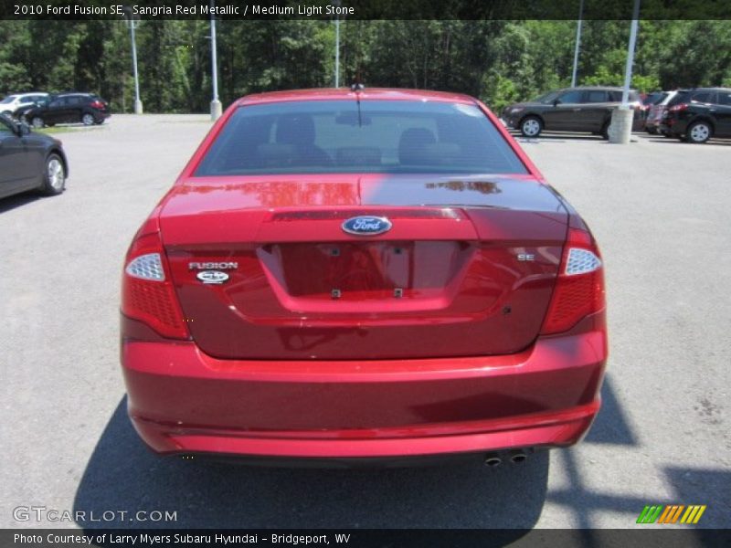 Sangria Red Metallic / Medium Light Stone 2010 Ford Fusion SE
