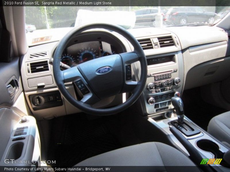 Sangria Red Metallic / Medium Light Stone 2010 Ford Fusion SE