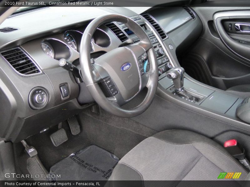Cinnamon Red Metallic / Light Stone 2010 Ford Taurus SEL