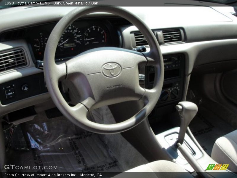 Dark Green Metallic / Oak 1998 Toyota Camry LE V6