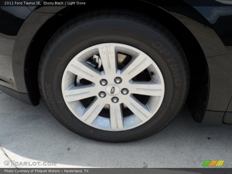 Ebony Black / Light Stone 2011 Ford Taurus SE