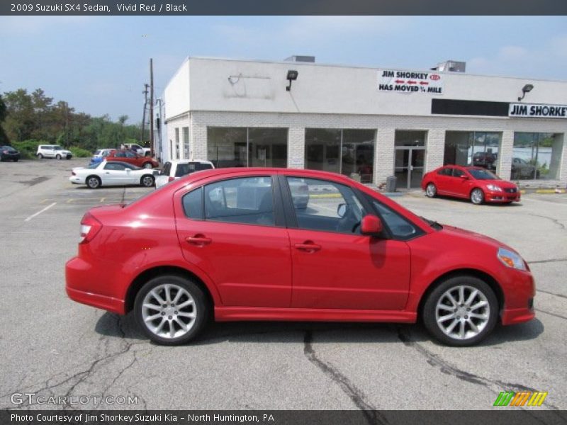 Vivid Red / Black 2009 Suzuki SX4 Sedan