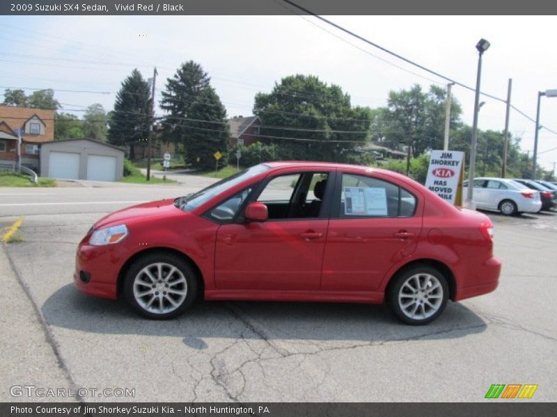 Vivid Red / Black 2009 Suzuki SX4 Sedan