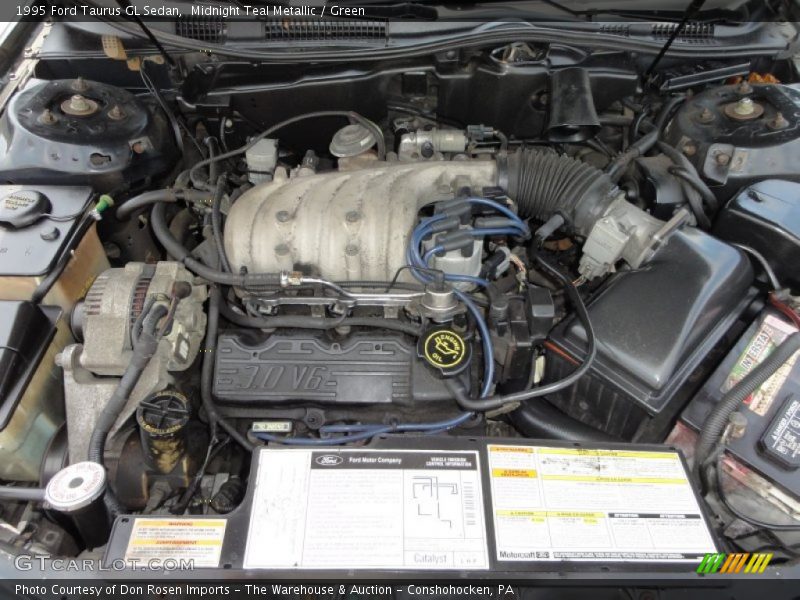 Midnight Teal Metallic / Green 1995 Ford Taurus GL Sedan