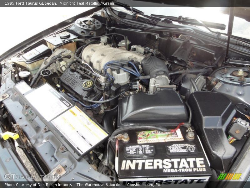 Midnight Teal Metallic / Green 1995 Ford Taurus GL Sedan