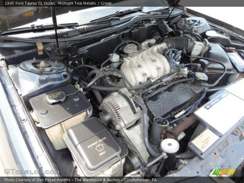 Midnight Teal Metallic / Green 1995 Ford Taurus GL Sedan