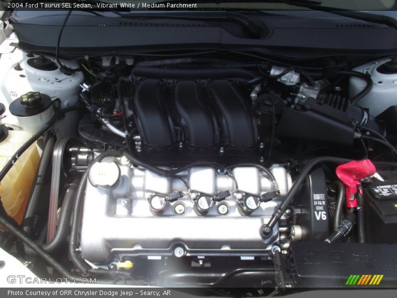 Vibrant White / Medium Parchment 2004 Ford Taurus SEL Sedan