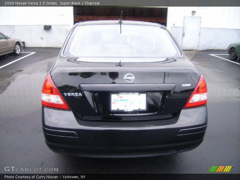 Super Black / Charcoal 2009 Nissan Versa 1.6 Sedan