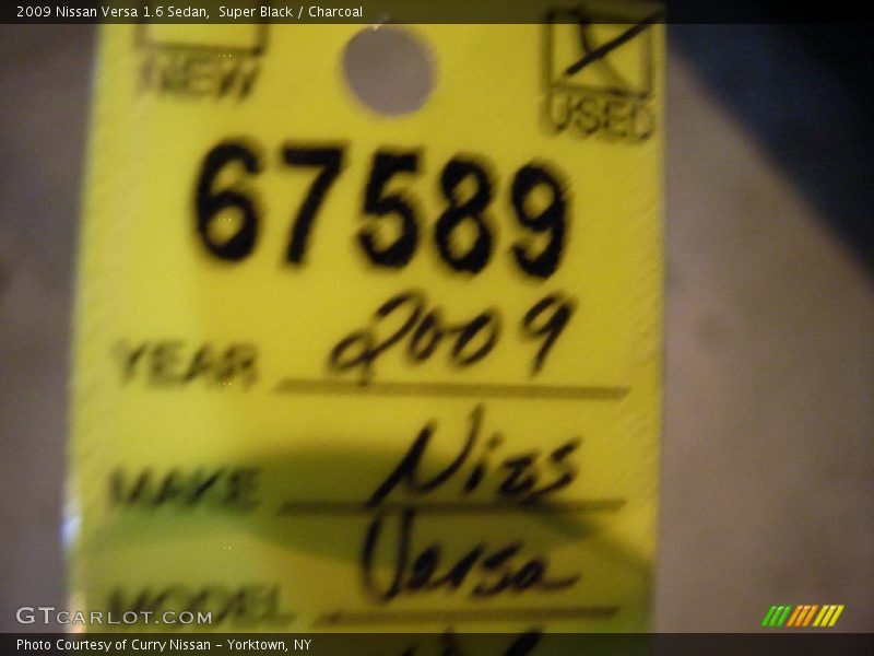 Super Black / Charcoal 2009 Nissan Versa 1.6 Sedan