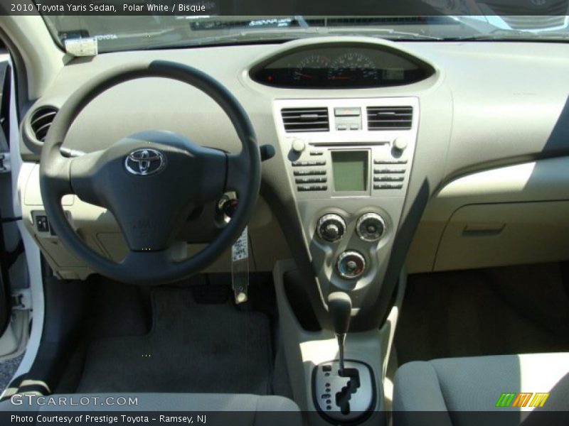 Polar White / Bisque 2010 Toyota Yaris Sedan