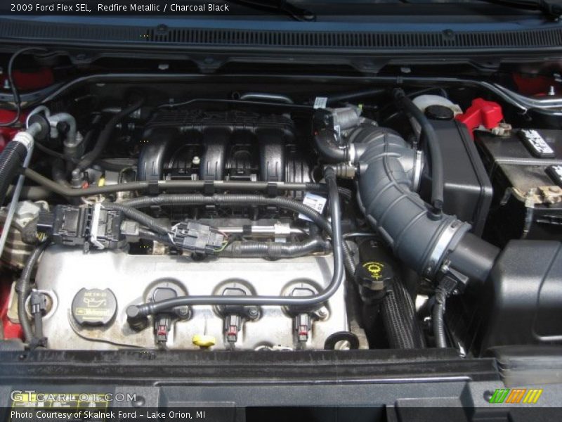 Redfire Metallic / Charcoal Black 2009 Ford Flex SEL