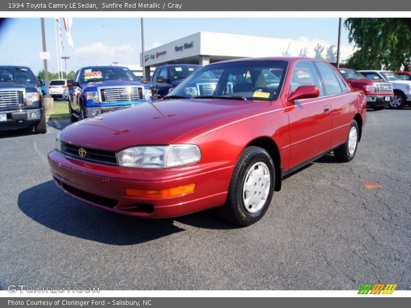 Sunfire Red Metallic / Gray 1994 Toyota Camry LE Sedan
