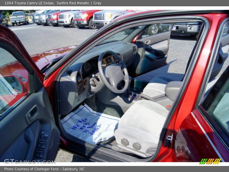 Sunfire Red Metallic / Gray 1994 Toyota Camry LE Sedan