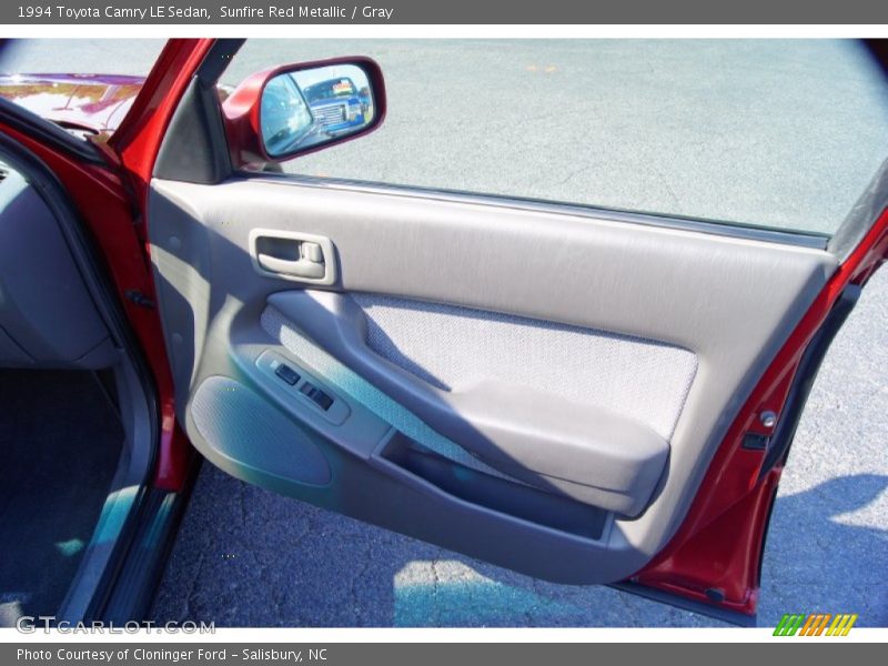 Sunfire Red Metallic / Gray 1994 Toyota Camry LE Sedan