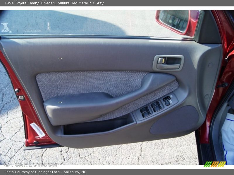 Sunfire Red Metallic / Gray 1994 Toyota Camry LE Sedan