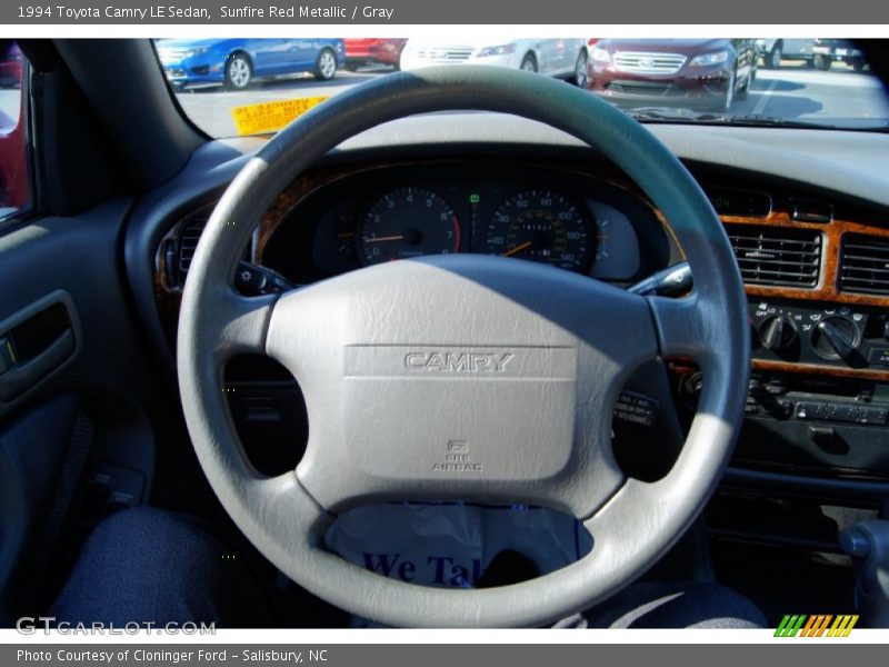 Sunfire Red Metallic / Gray 1994 Toyota Camry LE Sedan