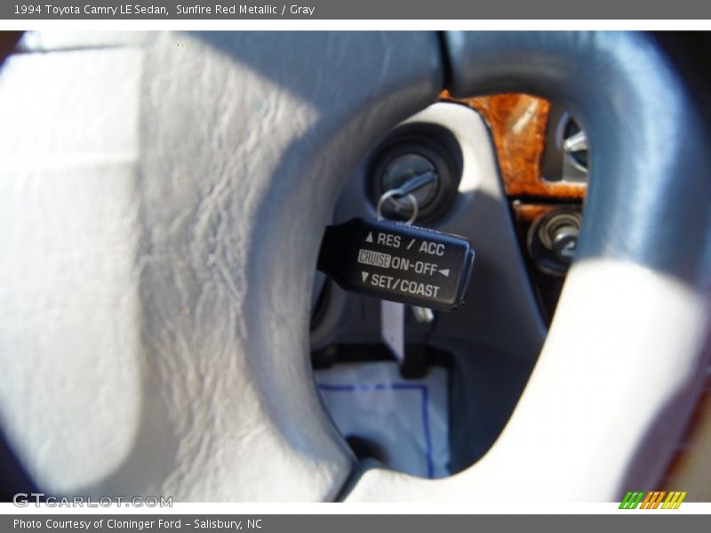 Sunfire Red Metallic / Gray 1994 Toyota Camry LE Sedan