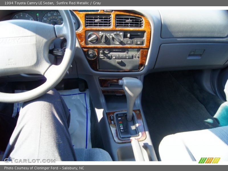 Sunfire Red Metallic / Gray 1994 Toyota Camry LE Sedan