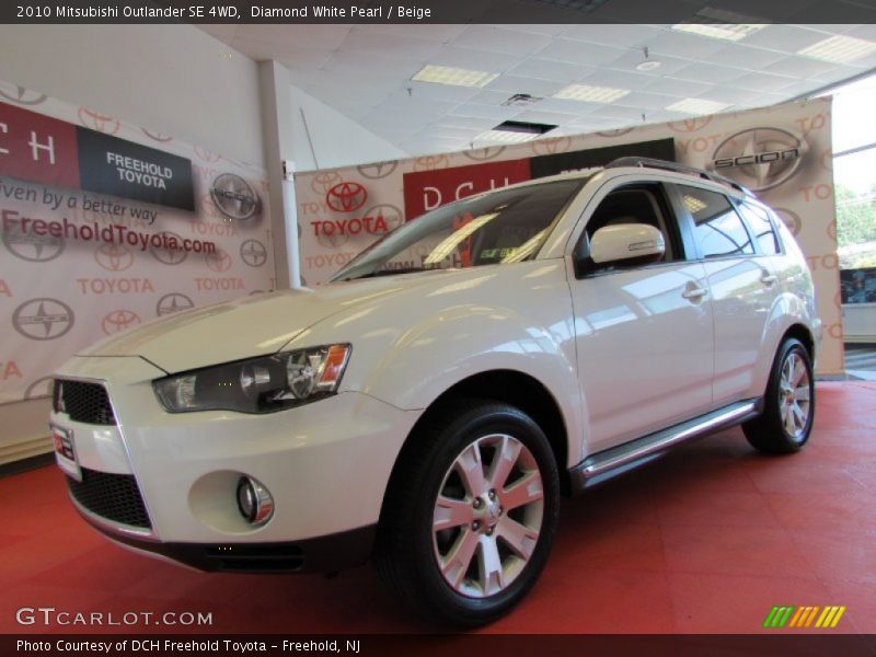 Diamond White Pearl / Beige 2010 Mitsubishi Outlander SE 4WD