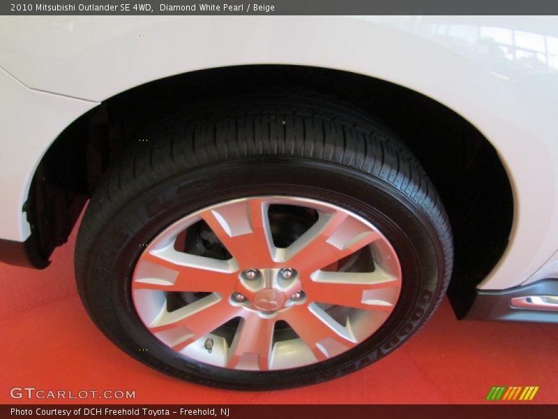 Diamond White Pearl / Beige 2010 Mitsubishi Outlander SE 4WD