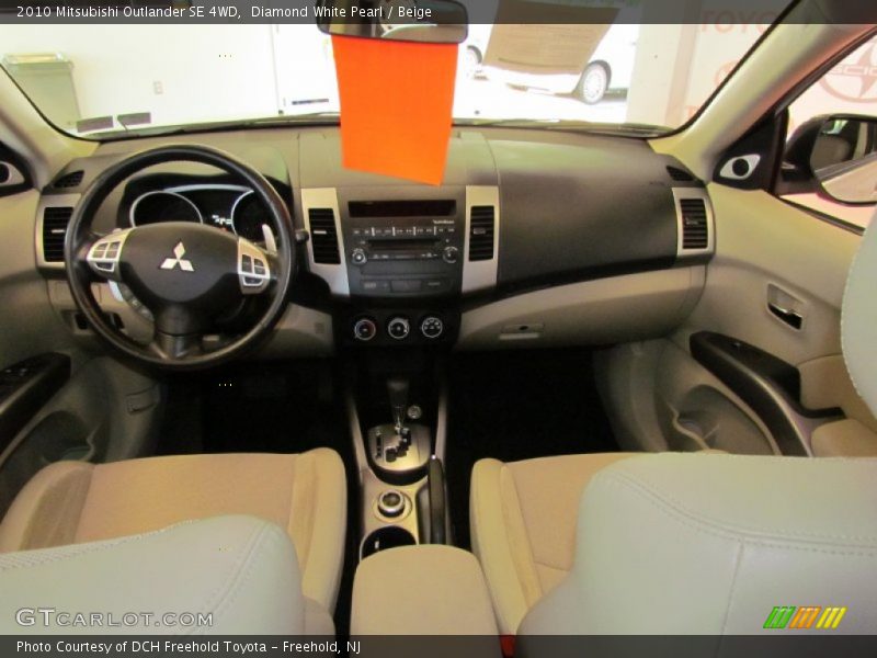 Diamond White Pearl / Beige 2010 Mitsubishi Outlander SE 4WD