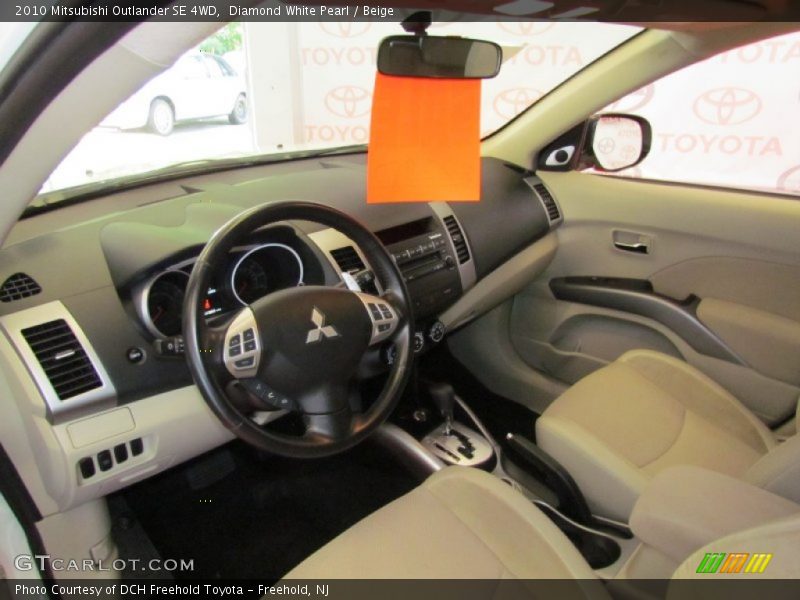 Diamond White Pearl / Beige 2010 Mitsubishi Outlander SE 4WD
