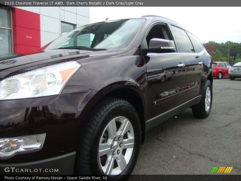 Dark Cherry Metallic / Dark Gray/Light Gray 2010 Chevrolet Traverse LT AWD