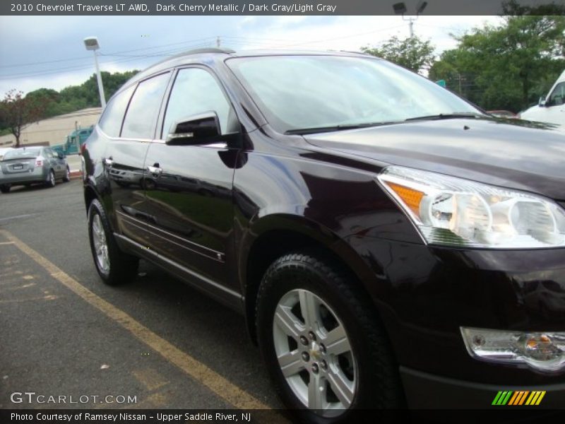 Dark Cherry Metallic / Dark Gray/Light Gray 2010 Chevrolet Traverse LT AWD
