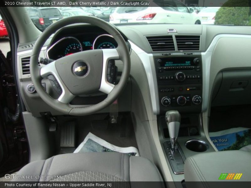 Dark Cherry Metallic / Dark Gray/Light Gray 2010 Chevrolet Traverse LT AWD
