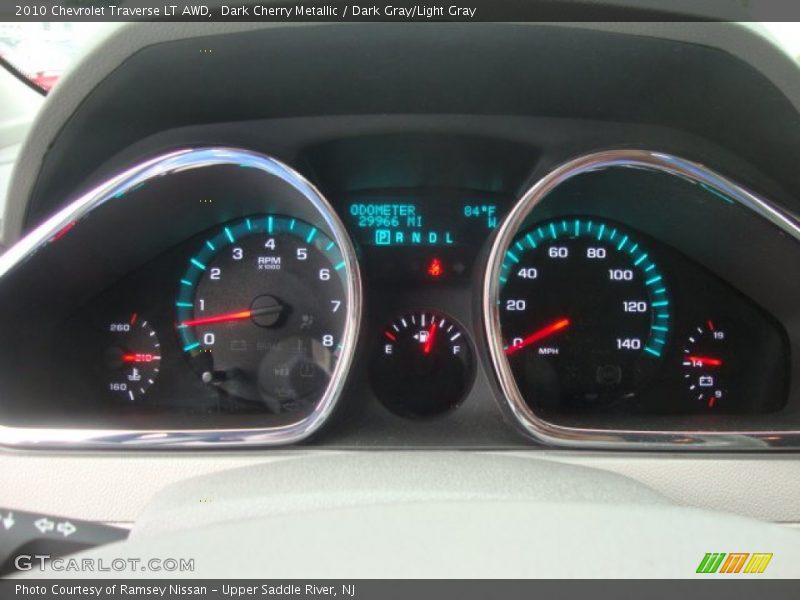 Dark Cherry Metallic / Dark Gray/Light Gray 2010 Chevrolet Traverse LT AWD