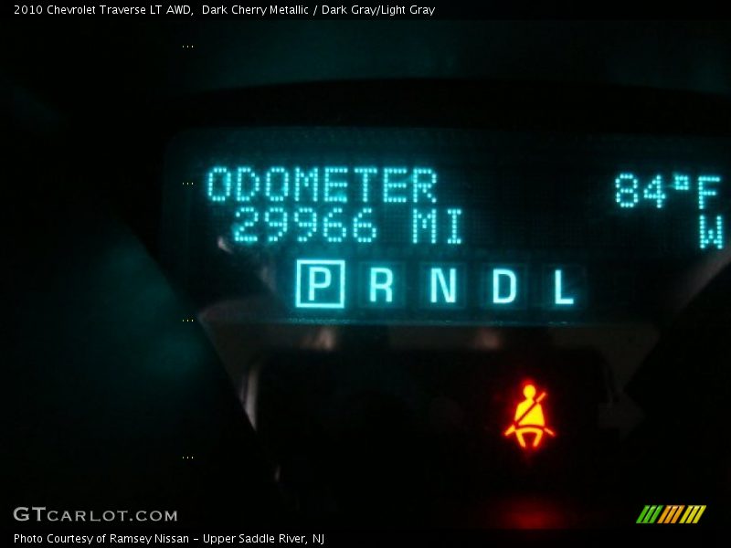 Dark Cherry Metallic / Dark Gray/Light Gray 2010 Chevrolet Traverse LT AWD