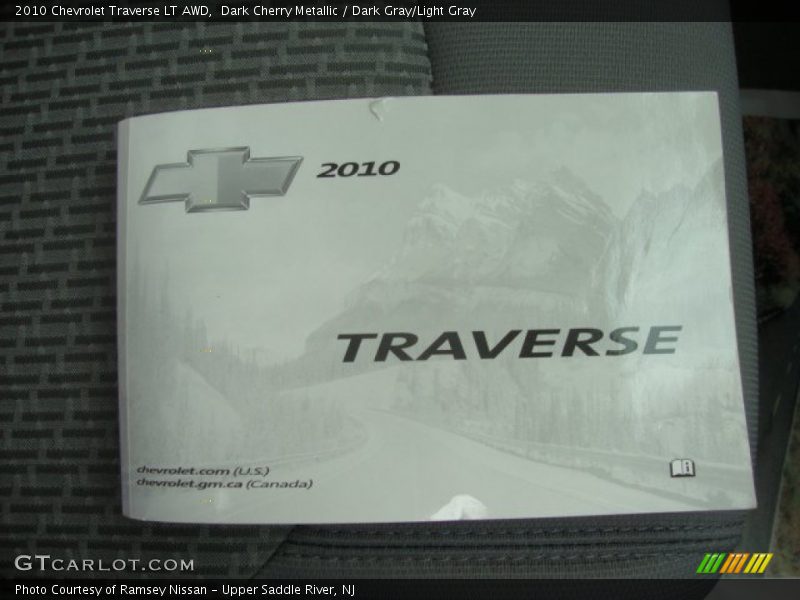 Dark Cherry Metallic / Dark Gray/Light Gray 2010 Chevrolet Traverse LT AWD
