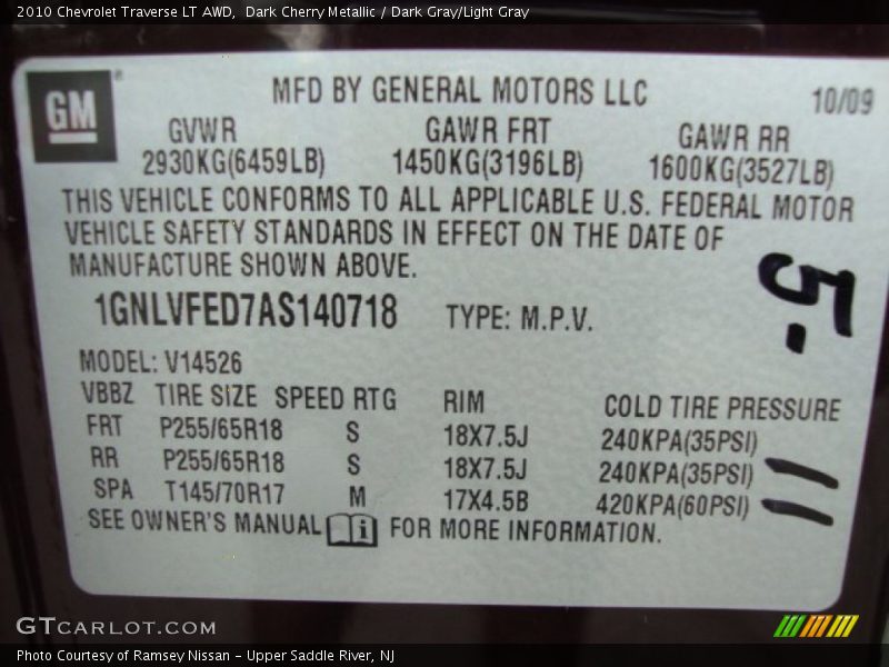 Dark Cherry Metallic / Dark Gray/Light Gray 2010 Chevrolet Traverse LT AWD