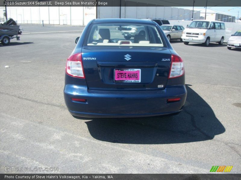 Deep Sea Blue Metallic / Beige 2010 Suzuki SX4 Sedan LE