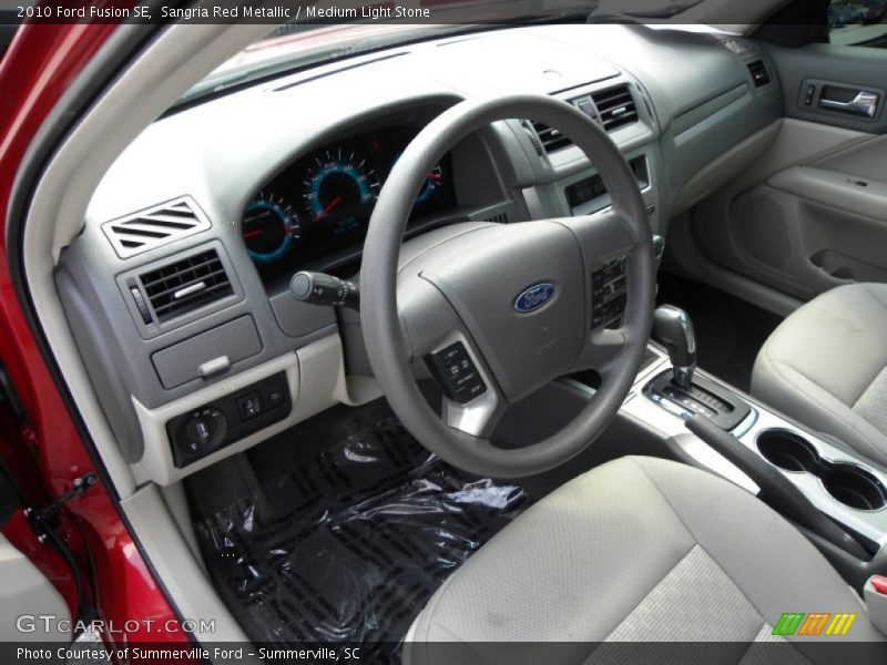 Sangria Red Metallic / Medium Light Stone 2010 Ford Fusion SE