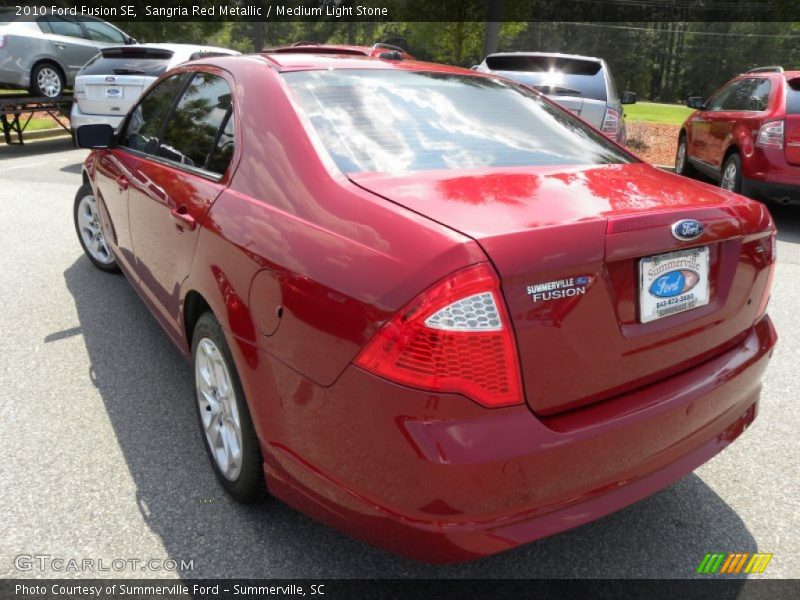 Sangria Red Metallic / Medium Light Stone 2010 Ford Fusion SE