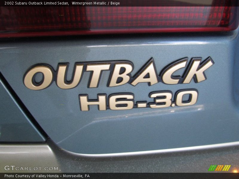  2002 Outback Limited Sedan Logo