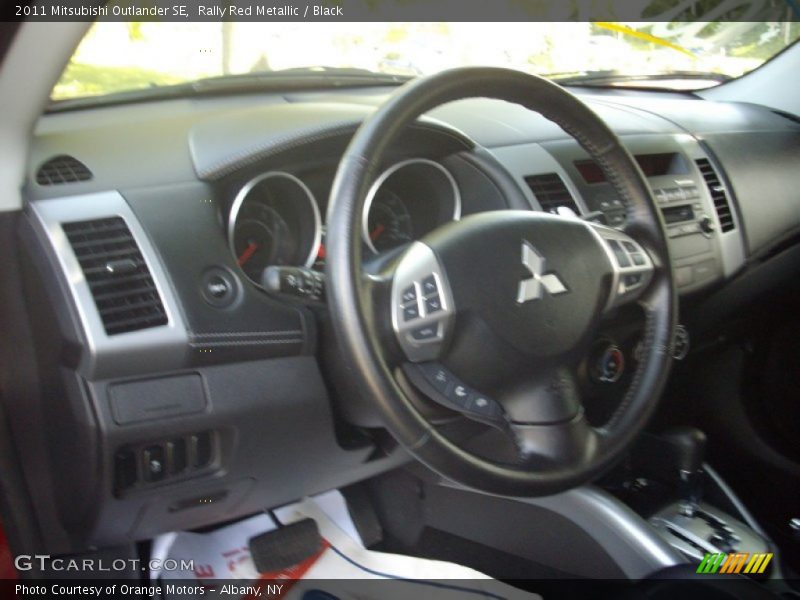 Rally Red Metallic / Black 2011 Mitsubishi Outlander SE