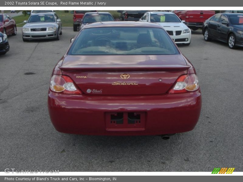 Red Flame Metallic / Ivory 2002 Toyota Solara SE Coupe