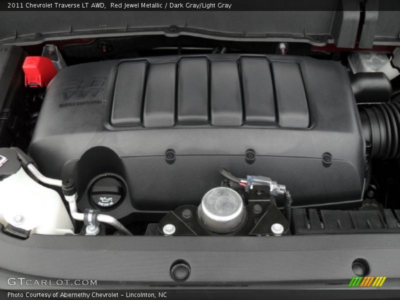 Red Jewel Metallic / Dark Gray/Light Gray 2011 Chevrolet Traverse LT AWD