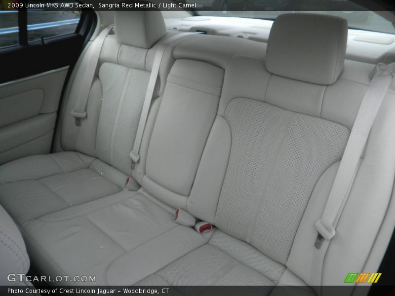 Sangria Red Metallic / Light Camel 2009 Lincoln MKS AWD Sedan