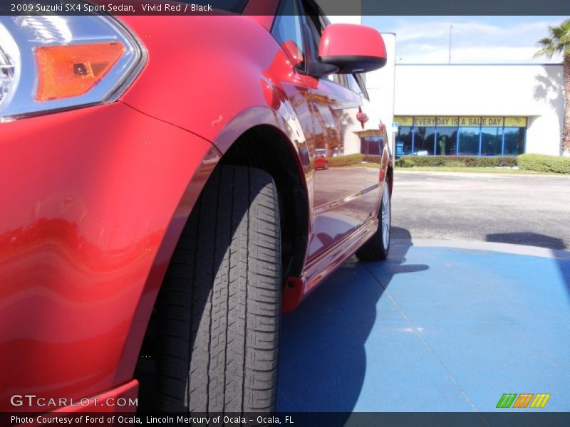 Vivid Red / Black 2009 Suzuki SX4 Sport Sedan