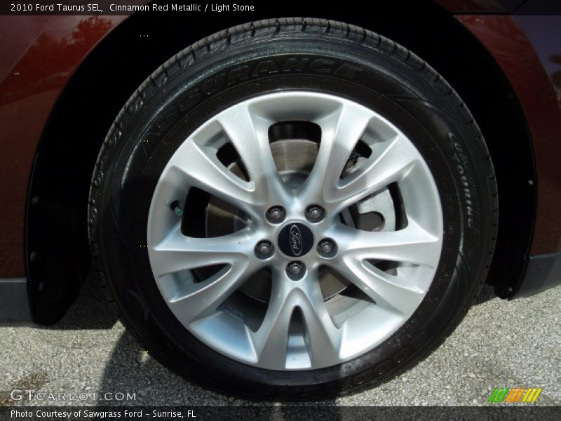 Cinnamon Red Metallic / Light Stone 2010 Ford Taurus SEL