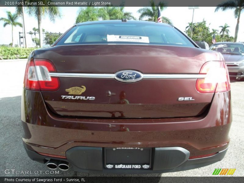 Cinnamon Red Metallic / Light Stone 2010 Ford Taurus SEL
