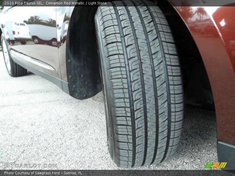 Cinnamon Red Metallic / Light Stone 2010 Ford Taurus SEL