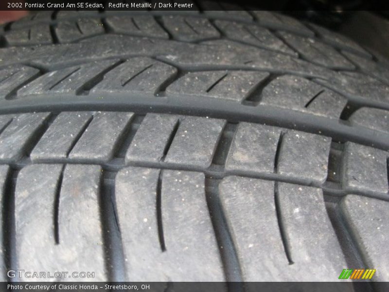 Redfire Metallic / Dark Pewter 2002 Pontiac Grand Am SE Sedan